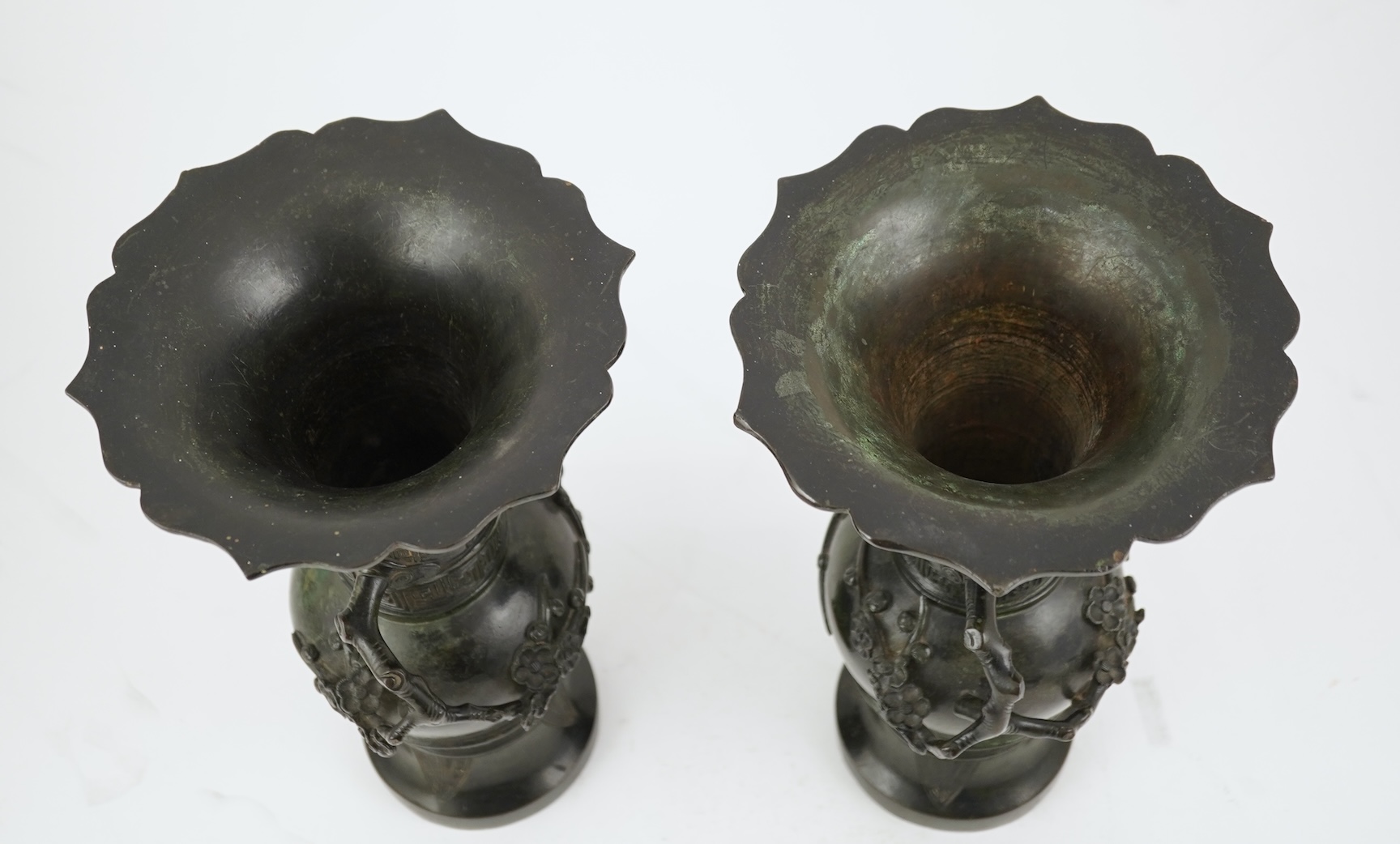 A pair of Chinese bronze gu-shaped vases, Qing dynasty